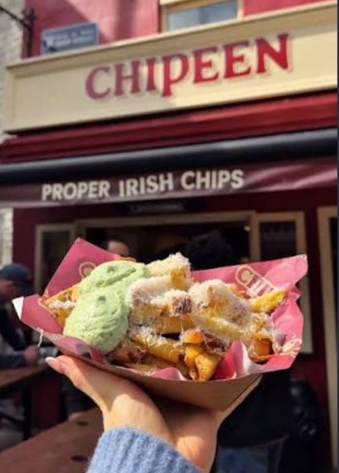 Loaded Irish chips outside Chipeen on Shop Street in Galway City